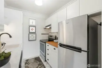 Sleek layout with ample storage and easy access to dining and living spaces.