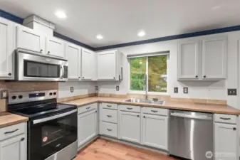 Brand new stainless steel appliances stay.