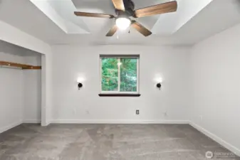 Primary bedroom with sky lights.