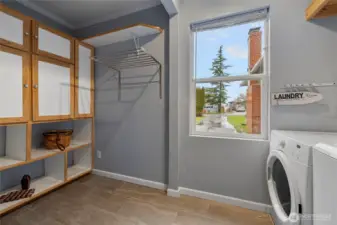 Laundry area with nice cabinets with brand new cloths washer