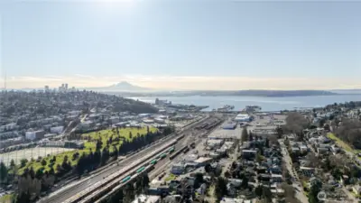 Views of downtown Seattle, Mt. Rainier, and Magnolia Park.