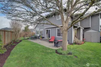 Everything is here for you...entertainment patio with remote awning, large side yard for play area, shed for storage, garden space on the northside and lovely lawn areas in between.