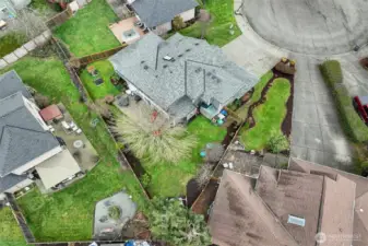 This aerial view shows the complete home site.  Located on a cul-de-sac, the pie shaped lot offers a small front yard to manage and a large backyard to enjoy how you choose.