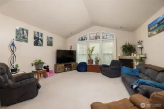 Large windows bring in the light, and vaulted ceilings open the space