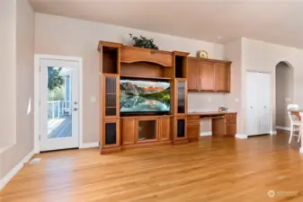 Great room with door leading to back deck over looking the water