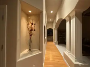 Elegant hardwood hallway with niches