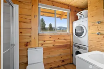 3/4 bath off of the primary bedroom with washer and dryer.