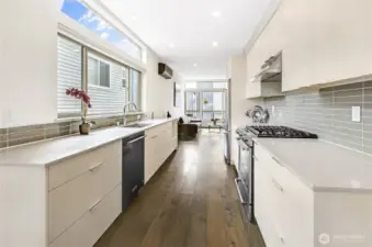 Awesome kitchen a six-burner gas stove, stainless refrigerator with French doors and bottom freezer. Beautiful wood floors throughout.