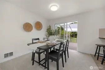 Dining room with slider out to covered deck
