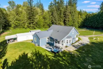 Great shot showing the back porch and the included hot tub.