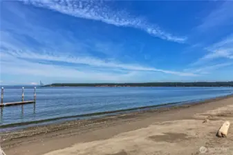 View of the private beach that the condo owner can enjoy, and dogs are allowed on leashes. Note Mt. Baker rising above all in the middle of the left-hand side of the photo, and Marrowstone Island is in the background.
