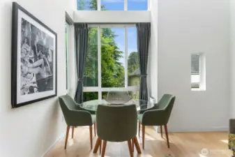 Light and airy dining area with vaulted ceilings. Enjoy urban living and still have those green views!
