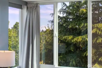 Intentionally designed end-unit that minimized shared walls and sightlines, this home provides a rare sense of quiet and retreat.  Mountain views from the primary suite!