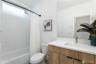 Tastefully designed full bath on lower level.
