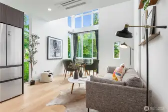 Double height living/dining area on main floor.