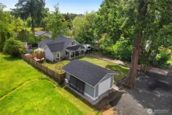 Charming Property with heated and cooled garage w/ rolling door shown and man door on other side.