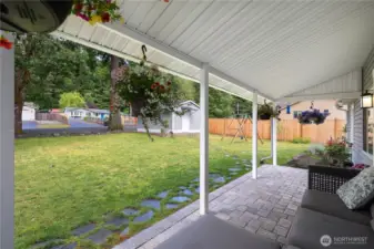 Cute front porch ready for you to relax and enjoy your beautiful yard.