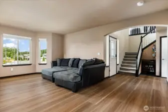Beautiful warm engineered wood flooring throughout main level