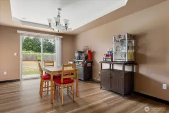 Spacious dining area with easy access to both the kitchen and patio making entertaining a breeze