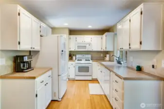 The kitchen cabinets were recently painted and equipped with new hardware for a stylish upgrade. Plenty of counter space for meal prep. And all appliances stay!