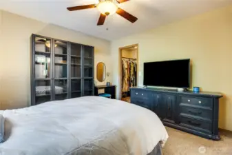 The walk-in closet can house an expansive wardrobe and has space for an additional dresser between the hanging racks!