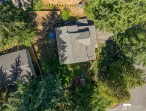 The birds-eye view of this lot shows off the natural setting and extra privacy—a great mix of sun and shade throughout the day for your plants and garden beds.