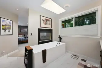 5 fixture bath with gas fireplace and free standing soaking tub.