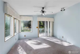 The family room has access to the beautiful trex deck which overlooks the greenbelt of lawn and trees.  Plenty of space for your BBQ and patio furniture.