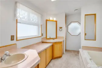 Primary 5 piece bath has a sequestered commode and TWO linen closets!  Additionally there is an oversized shower and deep soaking tub.
