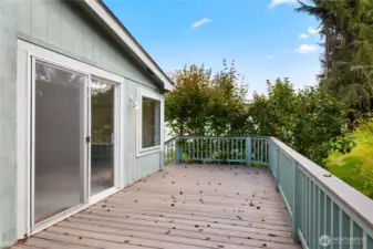 A second set of stairs that lends access to the side yard.   Nice privacy with the mature plantings.