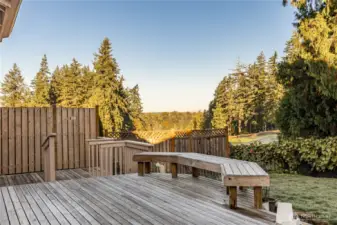 The back decks and backyard overlook the 11th green and 12th tee of the Auburn Golf Course