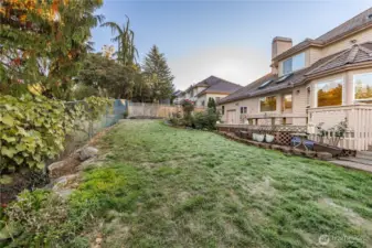 A long panoramic view of the back yard area of the property