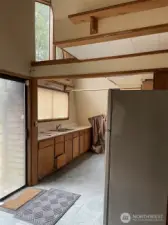 Kitchen with slider to deck