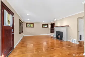 Spacious living room with wood burning fireplace