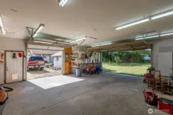 Inside of the detached garage, showing both roll up doors