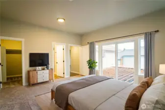 PRIMARY BEDROOM...SLIDER TO HUGE DECK....WALK IN CLOSET TO LEFT