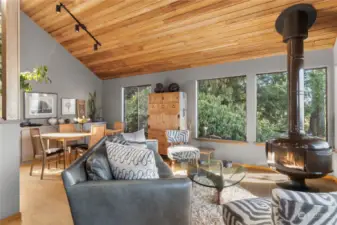 Step down into the welcoming family room, with cedar planking  throughout.