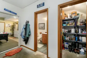 Garage level half bath. Owner's locked closet with metal shelving. Perfect mud room.