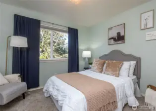 Light filled bedroom on the second floor.