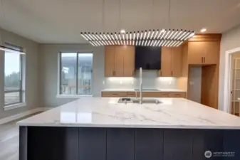 Kitchen with large island with eating area