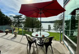 Dine al fresco on the spacious deck overlooking the dock and waterfront.