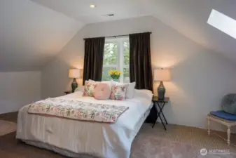 Bright and sunny upper level bonus room with skylight.