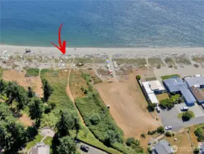 Accross Mutiny Bay Road, and down Mutiny Sands Rd, You'll find the private community beach!