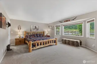 Wake up in this Primary suite, looking out into the back pasture and barn.  Includes walk-in closet, primary bath suite and private door to the back deck.