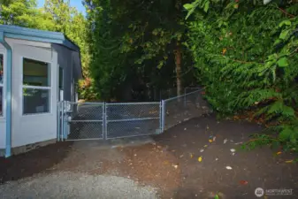 Large fully fenced back yard area. - Could run a driveway to divided back lot area through here.