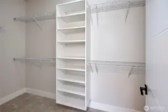 Built in shelving in walk-in closet