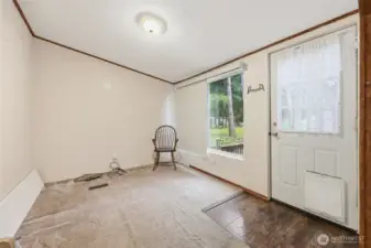 Den/office with door to back deck and covered sitting area.