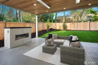 Outdoor covered living space with fireplace