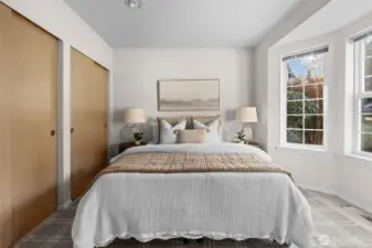 Secondary bedroom offers expansive storage with dual closet spaces.