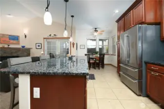 Large kitchen with slab granite.